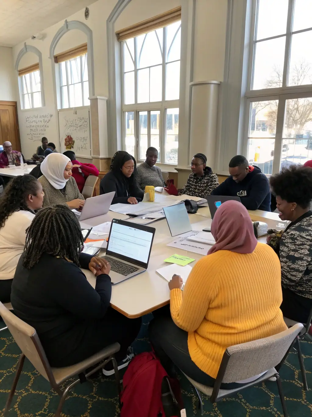 A photograph capturing participants actively engaged in a Cultural Mediation Workshop, fostering dialogue and cultural exchange within the community.
